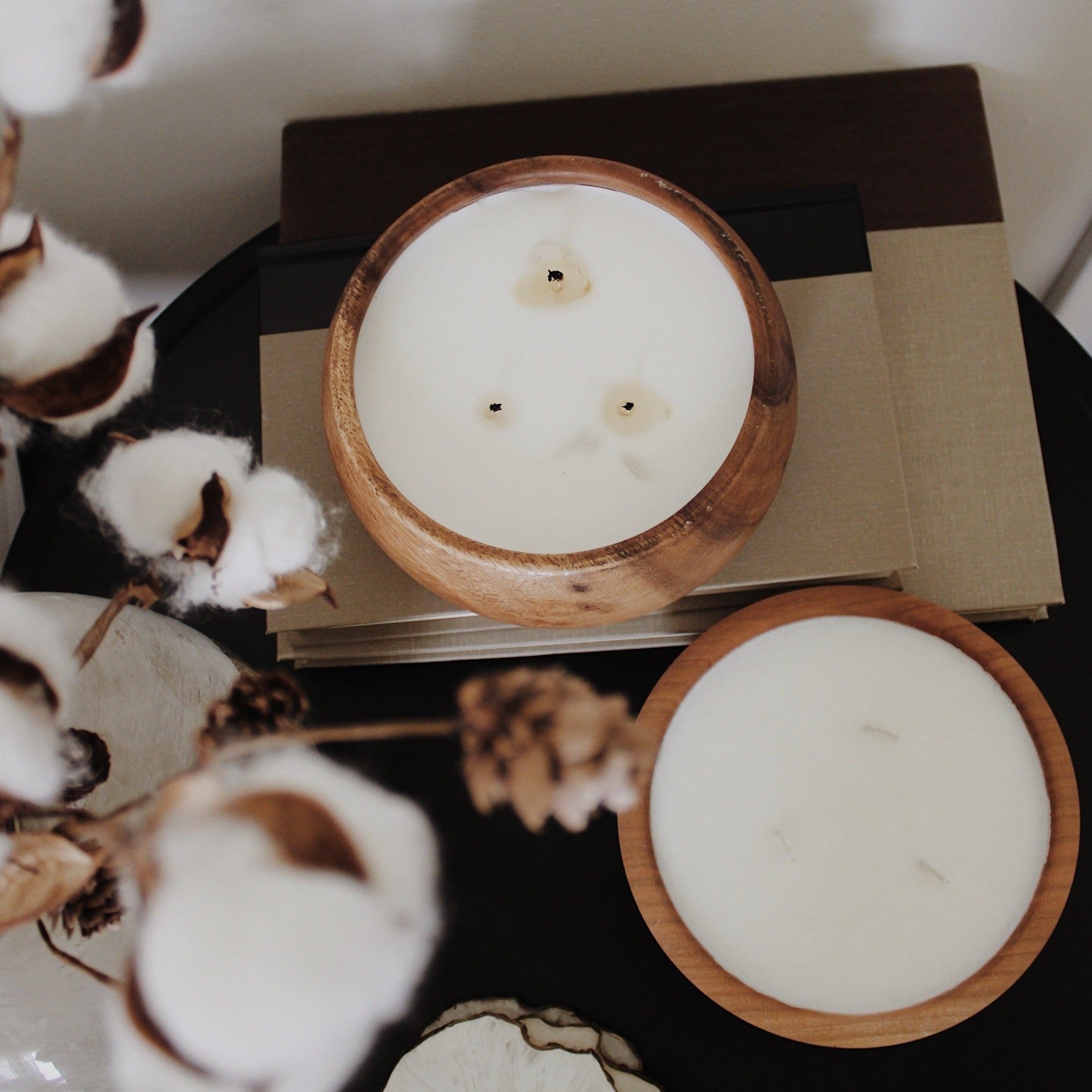 Two wooden bowls with candles visible from above. Made by Paige Soy Candles